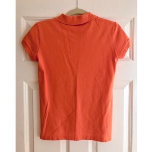 Lacoste Tops - Lacoste women’s orange polo shirt - size 36 (US 4) Lacoste Tops - Lacoste women’s orange polo shirt - size 36 (US 4)